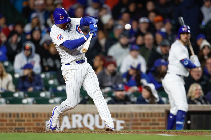 Apr 24, 2024; Chicago, Illinois, USA; Chicago Cubs second base Nico Hoerner (2) singles against the Houston Astros during the fourth inning at Wrigley Field. Mandatory Credit: Kamil Krzaczynski-USA TODAY Sports
