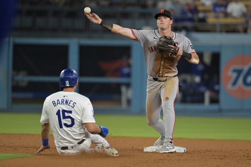 Jul 24, 2024; Los Angeles, California, USA;  Los Angeles Dodgers catcher Austin Barnes (15) is out at second as San Francisco Giants shortstop Tyler Fitzgerald (49) throws to first in the eighth inning at Dodger Stadium. Mandatory Credit: Jayne Kamin-Oncea-USA TODAY Sports