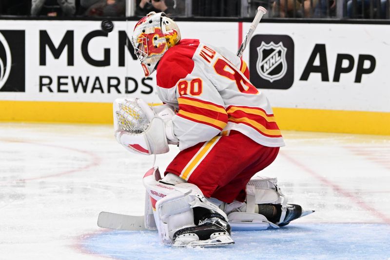 Oct 28, 2024; Las Vegas, Nevada, USA; Calgary Flames goaltender Dan Vladar (80) stops a shot from the Vegas Golden Knights in the second period at T-Mobile Arena. Mandatory Credit: Candice Ward-Imagn Images