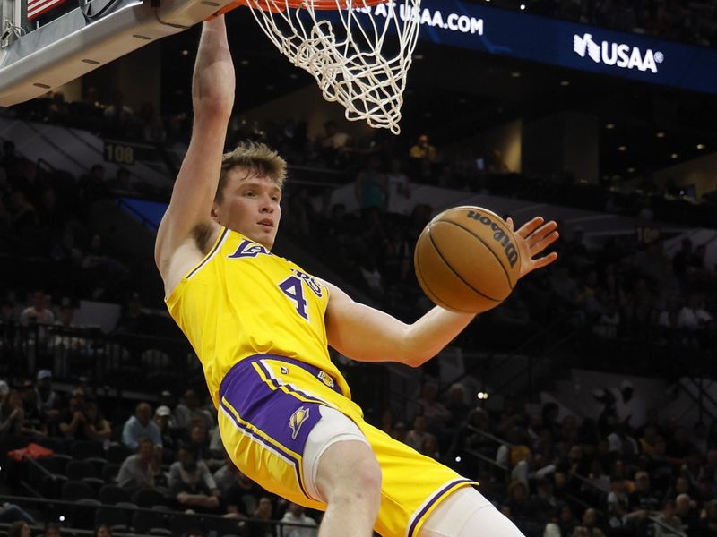 SAN ANTONIO, TEXAS - NOVEMBER 27: Dalton Knecht #4 of the Los Angeles Lakers dunks the ball during the fourth quarter against the San Antonio Spurs at Frost Bank Center on November 27, 2024 in San Antonio, Texas. NOTE TO USER: User expressly acknowledges and agrees that, by downloading and or using this photograph, User is consenting to the terms and conditions of the Getty Images License Agreement (Photo by Ronald Cortes/Getty Images)