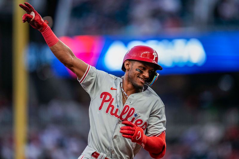 Sep 18, 2023; Cumberland, Georgia, USA; Philadelphia Phillies center fielder Johan Rojas (18) reacts after hitting a home run against the Atlanta Braves during the second inning at Truist Park. Mandatory Credit: Dale Zanine-USA TODAY Sports