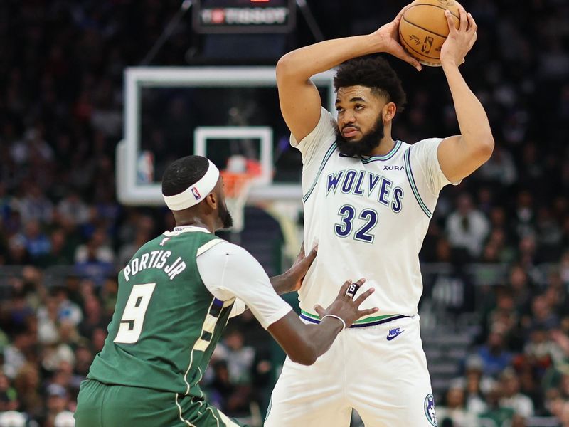 MILWAUKEE, WISCONSIN - FEBRUARY 08: Karl-Anthony Towns #32 of the Minnesota Timberwolves is defended by Bobby Portis #9 of the Milwaukee Bucks during a game at Fiserv Forum on February 08, 2024 in Milwaukee, Wisconsin. NOTE TO USER: User expressly acknowledges and agrees that, by downloading and or using this photograph, User is consenting to the terms and conditions of the Getty Images License Agreement. (Photo by Stacy Revere/Getty Images)