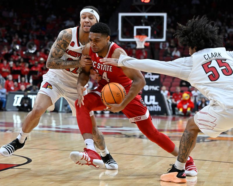 Jan 13, 2024; Louisville, Kentucky, USA;  North Carolina State Wolfpack guard Casey Morsell (14) drives to the basket against Louisville Cardinals guard Tre White (22) and guard Skyy Clark (55) during the first half at KFC Yum! Center. Mandatory Credit: Jamie Rhodes-USA TODAY Sports