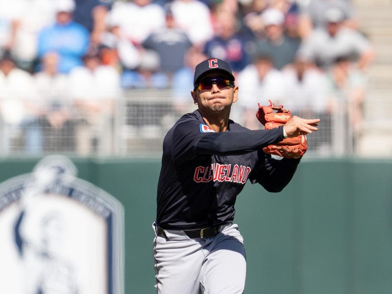 Apr 6, 2024; Minneapolis, Minnesota, USA; Cleveland Guardians shortstop Brayan Rocchio (4) throws to first base to retire Minnesota Twins first base Alex Kirilloff (19) completing a double play in the seventh inning at Target Field. Mandatory Credit: Matt Blewett-USA TODAY Sports