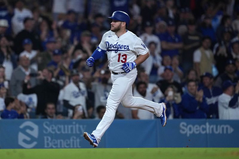 Sep 20, 2023; Los Angeles, California, USA; Los Angeles Dodgers third baseman Max Muncy (13) runs the bases after hitting a home run in the sixth inning against the Detroit Tigers at Dodger Stadium. Mandatory Credit: Kirby Lee-USA TODAY Sports