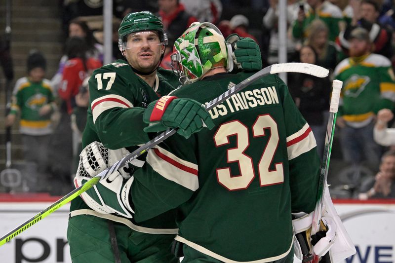 Jan 23, 2024; Saint Paul, Minnesota, USA;  Minnesota Wild forward Marcus Foligno (17) and goalie Filip Gustavsson (32) celebrates a victory against the Washington Capitals at Xcel Energy Center. Mandatory Credit: Nick Wosika-USA TODAY Sports