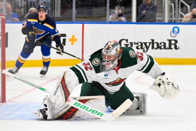 Nov 19, 2024; St. Louis, Missouri, USA;  Minnesota Wild goaltender Filip Gustavsson (32) defends the net against the St. Louis Blues during the second period at Enterprise Center. Mandatory Credit: Jeff Curry-Imagn Images