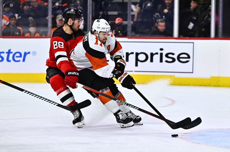 Apr 13, 2024; Philadelphia, Pennsylvania, USA; New Jersey Devils defenseman Kevin Bahl (88) defends Philadelphia Flyers right wing Travis Konecny (11) on a breakaway in the third period at Wells Fargo Center. Mandatory Credit: Kyle Ross-USA TODAY Sports