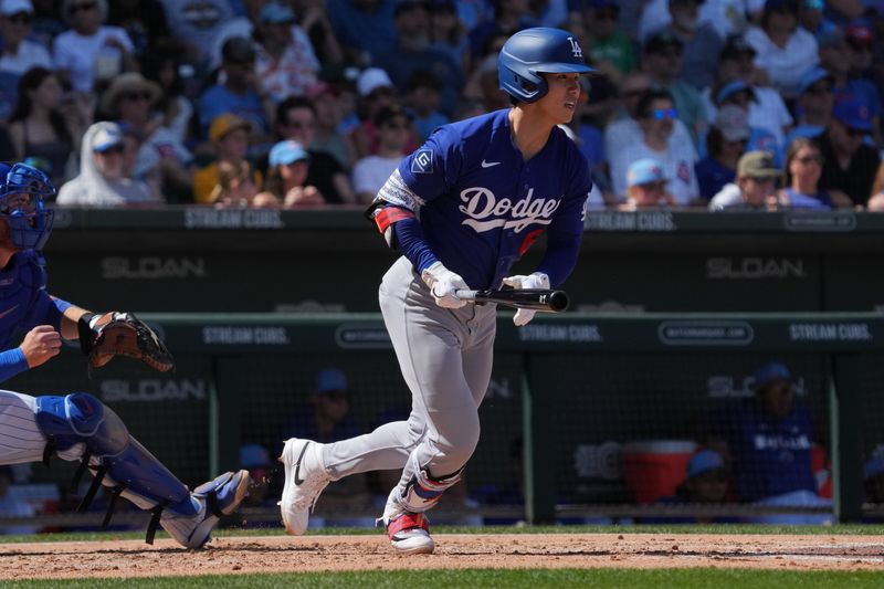 Mar 15, 2026; Mesa, Arizona, USA; Los Angeles Dodgers second baseman Hyeseong Kim (6) hits against the Chicago Cubs in the second inning at Sloan Park. Mandatory Credit: Rick Scuteri-Imagn Images