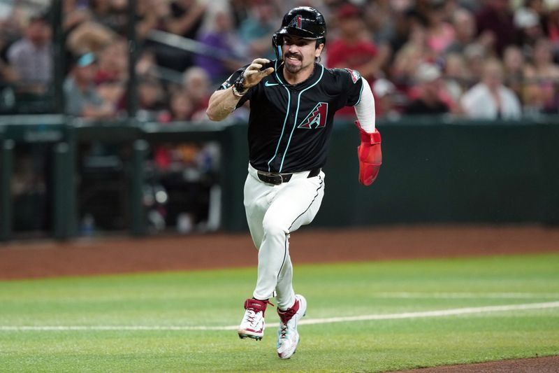 Jun 15, 2024; Phoenix, Arizona, USA; Arizona Diamondbacks outfielder Corbin Carroll (7) rounds third base and scores a run against the Chicago White Sox during the first inning at Chase Field. Mandatory Credit: Joe Camporeale-USA TODAY Sports