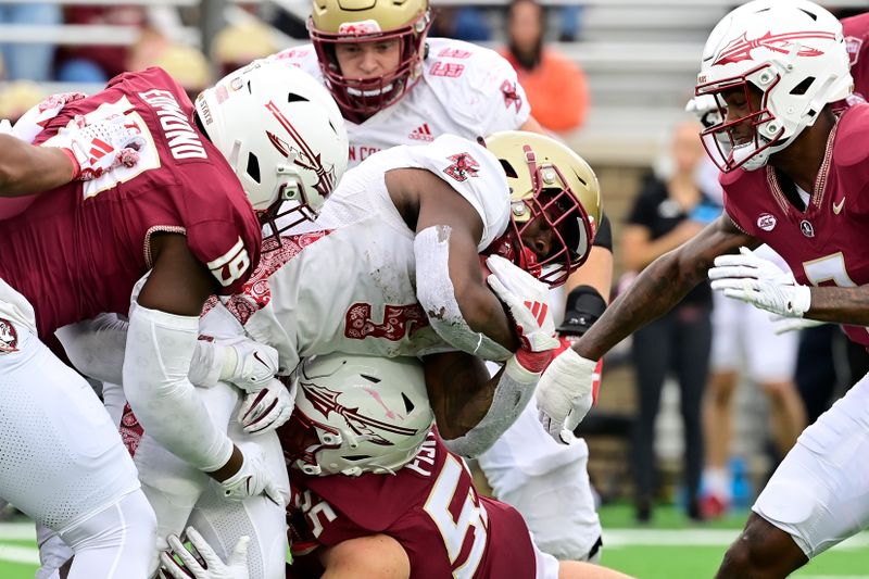 Sep 16, 2023; Chestnut Hill, Massachusetts, USA; Boston College Eagles running back Kye Robichaux (5) is tackled by Florida State Seminoles defensive lineman Braden Fiske (55) during the second half at Alumni Stadium. Mandatory Credit: Eric Canha-USA TODAY Sports