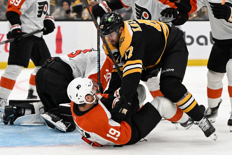 Oct 1, 2024; Boston, Massachusetts, USA; Boston Bruins center Mark Kastelic (47) checks Philadelphia Flyers right wing Garnet Hathaway (19) during the third period at the TD Garden. Mandatory Credit: Brian Fluharty-Imagn Images