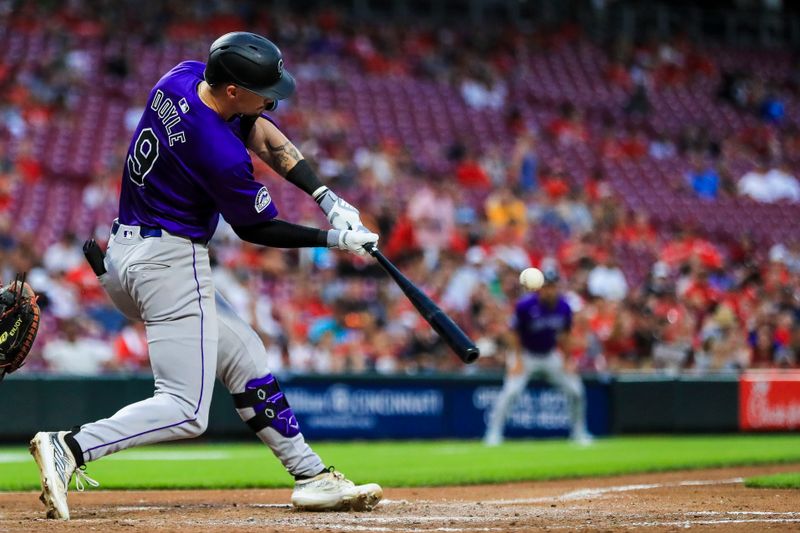 Jul 8, 2024; Cincinnati, Ohio, USA; Colorado Rockies outfielder Brenton Doyle (9) hits a single against the Cincinnati Reds in the seventh inning at Great American Ball Park. Mandatory Credit: Katie Stratman-USA TODAY Sports