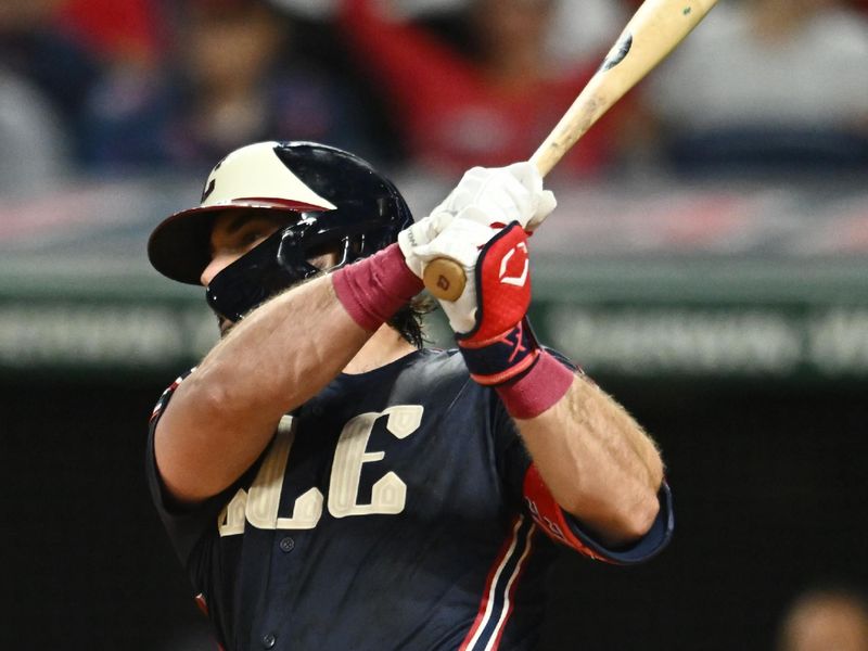 Aug 2, 2024; Cleveland, Ohio, USA; Cleveland Guardians catcher Austin Hedges (27) hits an RBI single during the sixth inning against the Baltimore Orioles at Progressive Field. Mandatory Credit: Ken Blaze-USA TODAY Sports