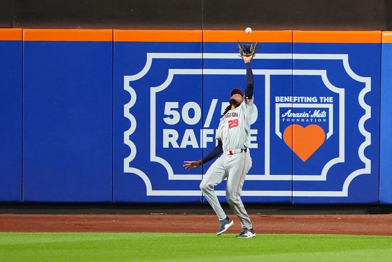 Jul 10, 2024; New York City, New York, USA; Washington Nationals left fielder James Wood (29) catches a fly ball hit by New York Mets left fielder Brandon Nimmo (not pictured) during the seventh inning at Citi Field. Mandatory Credit: Gregory Fisher-USA TODAY Sports