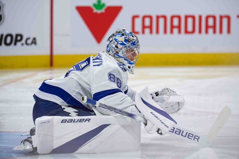 Oct 19, 2024; Ottawa, Ontario, CAN; Tampa Bay Lightning goalie Andrei Vasilevskiy (88) stretches prior to the start of game against the Ottawa Senators at the Canadian Tire Centre. Mandatory Credit: Marc DesRosiers-Imagn Images