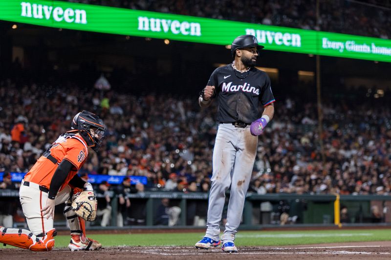 Aug 30, 2024; San Francisco, California, USA; Miami Marlins left fielder Derek Hill (58) scores in front of San Francisco Giants catcher Patrick Bailey (14) during the seventh inning at Oracle Park. Mandatory Credit: John Hefti-USA TODAY Sports
