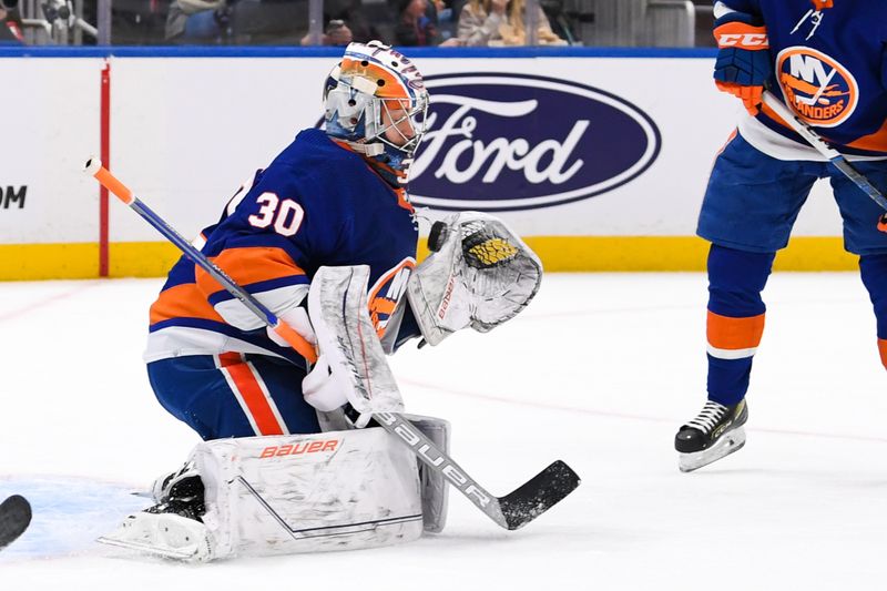 Oct 26, 2023; Elmont, New York, USA; New York Islanders goaltender Ilya Sorokin (30) makes a save against the Ottawa Senators during the first period at UBS Arena. Mandatory Credit: Dennis Schneidler-USA TODAY Sports