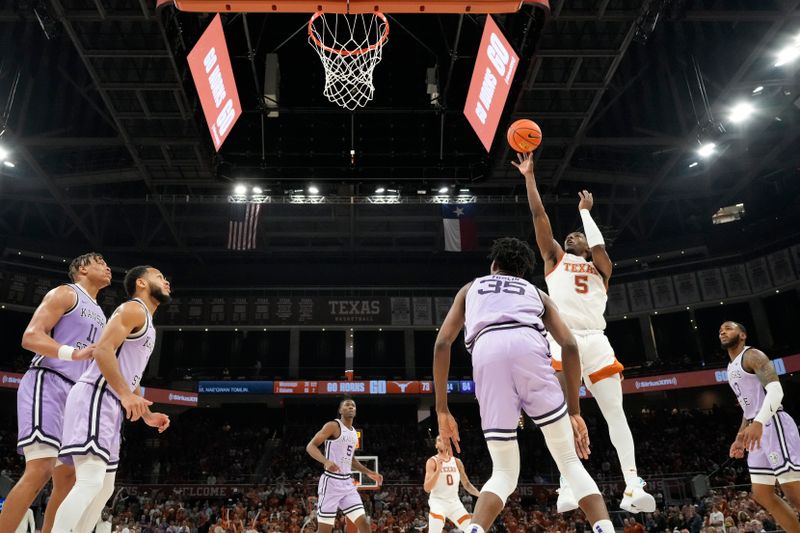 Jan 3, 2023; Austin, Texas, USA; Texas Longhorns guard Marcus Carr (5) shoots over Kansas State Wildcats forward Nae'Qwan Tomlin (35) during the second half at Moody Center. Mandatory Credit: Scott Wachter-USA TODAY Sports