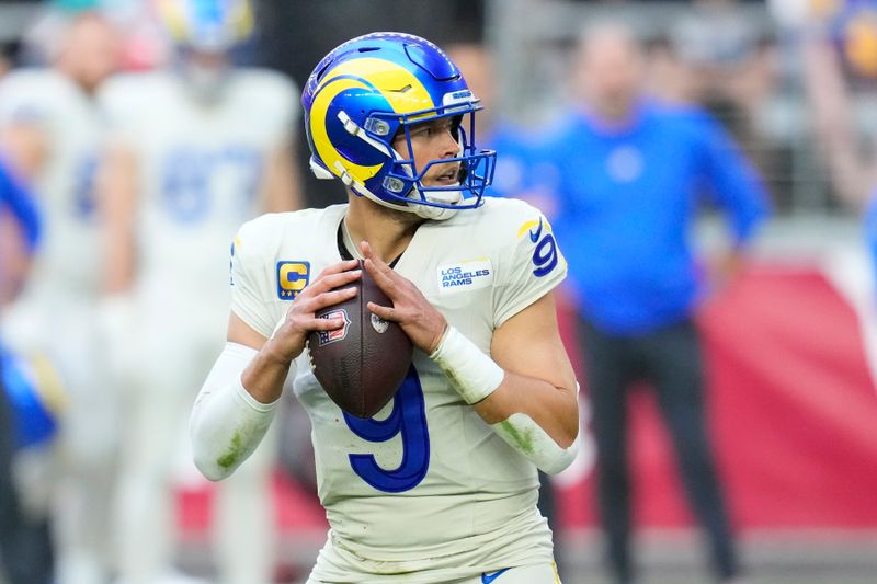 Los Angeles Rams quarterback Matthew Stafford looks to pass the ball against the Arizona Cardinals during the first half of an NFL football game Sunday, Nov. 26, 2023, in Glendale, Ariz. The Rams won 37-14. (AP Photo/Ross D. Franklin)