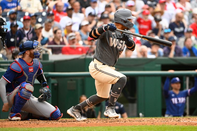 Jul 8, 2023; Washington, District of Columbia, USA; Washington Nationals third baseman Ildemaro Vargas (14) singles against the Texas Rangers during the fifth inning at Nationals Park. Mandatory Credit: Brad Mills-USA TODAY Sports