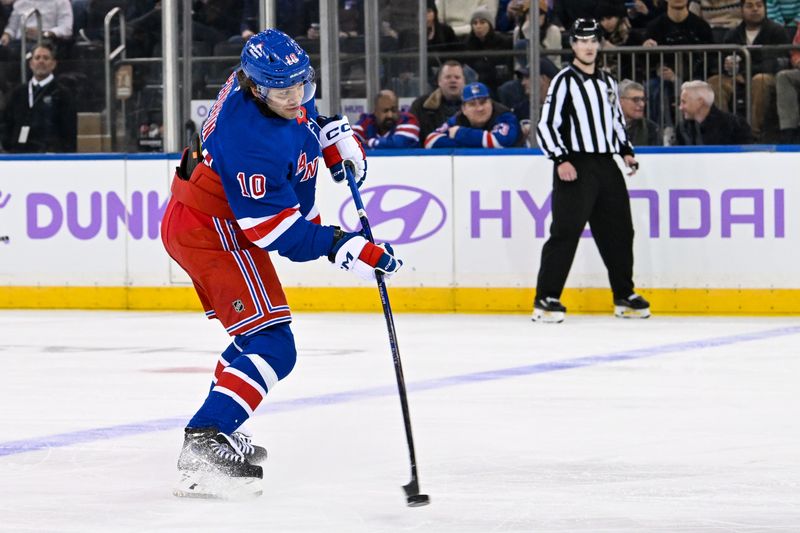 Jan 7, 2025; New York, New York, USA;  New York Rangers left wing Artemi Panarin (10) attempts a shot against the Dallas Stars during the third period at Madison Square Garden. Mandatory Credit: Dennis Schneidler-Imagn Images