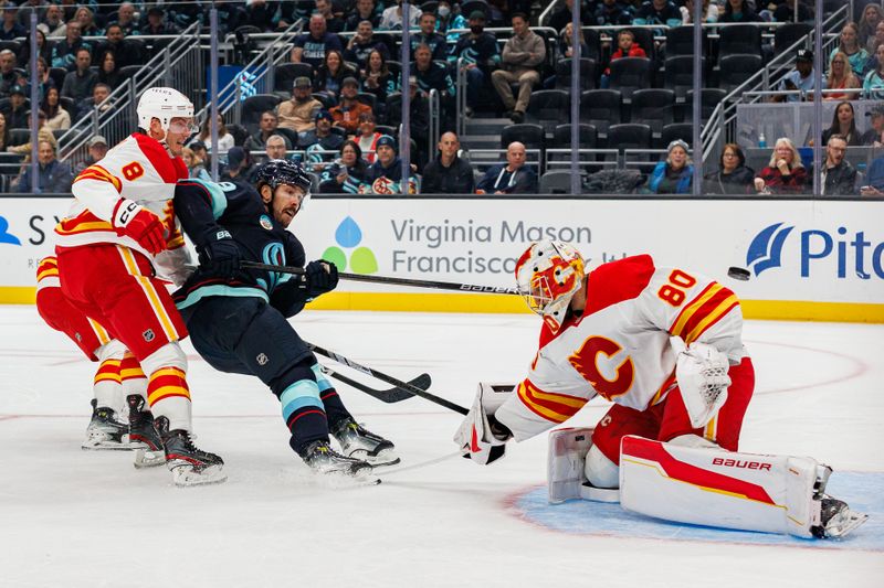 Oct 19, 2024; Seattle, Washington, USA; Seattle Kraken center Chandler Stephenson (9) shoots against Calgary Flames goaltender Dan Vladar (80) during the first period at Climate Pledge Arena. Mandatory Credit: Caean Couto-Imagn Images