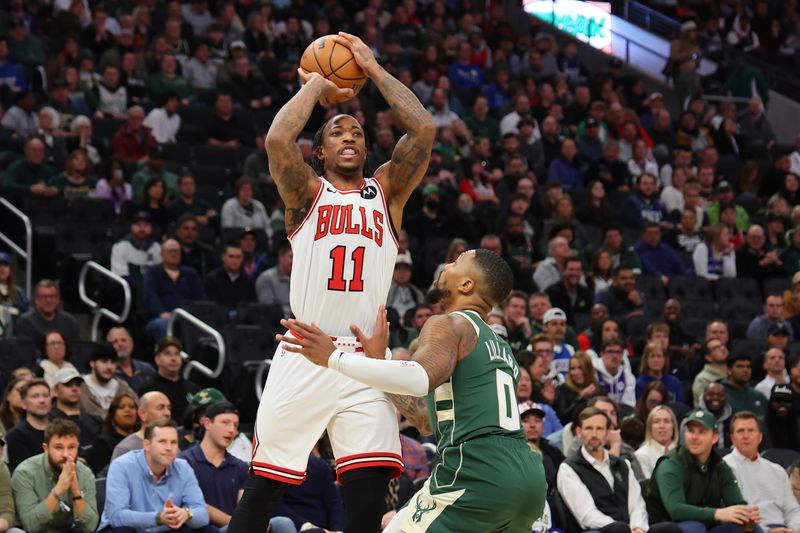 MILWAUKEE, WISCONSIN - DECEMBER 11: DeMar DeRozan #11 of the Chicago Bulls is defended by Damian Lillard #0 of the Milwaukee Bucks during a game at Fiserv Forum on December 11, 2023 in Milwaukee, Wisconsin. NOTE TO USER: User expressly acknowledges and agrees that, by downloading and or using this photograph, User is consenting to the terms and conditions of the Getty Images License Agreement. (Photo by Stacy Revere/Getty Images)