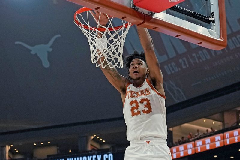 Dec 9, 2023; Austin, Texas, USA; Texas Longhorns forward Dillon Mitchell (23) dunks during the first half against the Houston Christian Huskies at Moody Center. Mandatory Credit: Scott Wachter-USA TODAY Sports