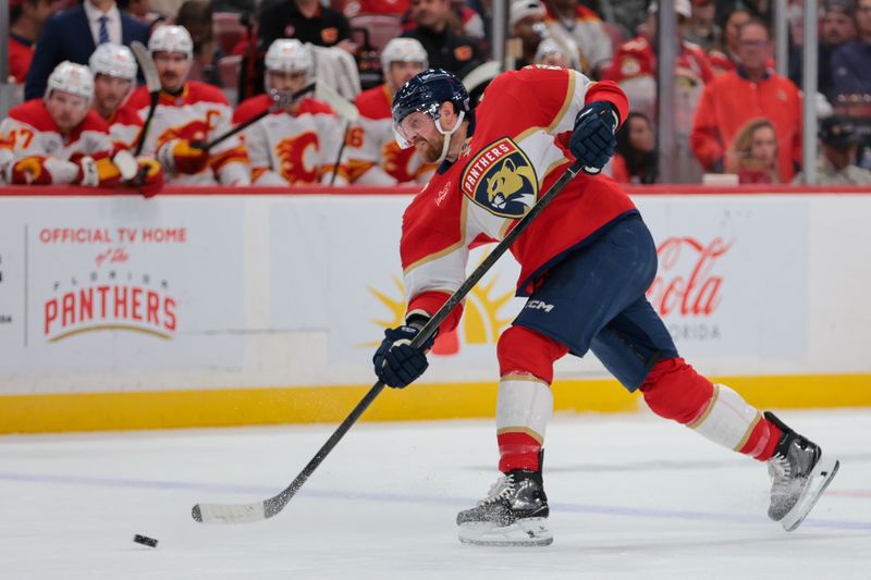 Nov 28, 2025; Sunrise, Florida, USA; Florida Panthers defenseman Jeff Petry (2) shoots the puck against the Calgary Flames during the first period at Amerant Bank Arena. Mandatory Credit: Sam Navarro-Imagn Images