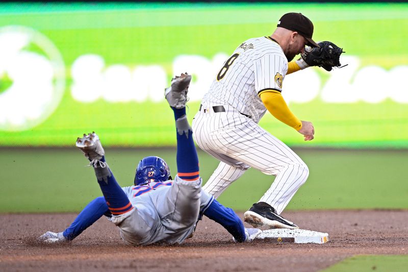 Aug 22, 2024; San Diego, California, USA; New York Mets third baseman Mark Vientos (27) is doubled off at second base by San Diego Padres shortstop Mason McCoy (18) during the first inning at Petco Park. Mandatory Credit: Orlando Ramirez-USA TODAY Sports