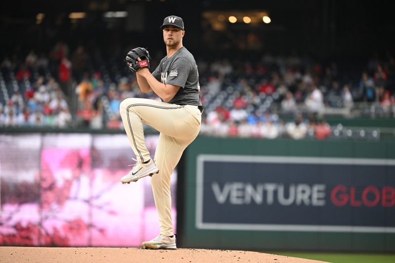 Sep 29, 2024; Washington, District of Columbia, USA; Washington Nationals starting pitcher Jake Irvin (27) prepares to throw a pitch against the Philadelphia Phillies during the first inning at Nationals Park. Mandatory Credit: Rafael Suanes-Imagn Images