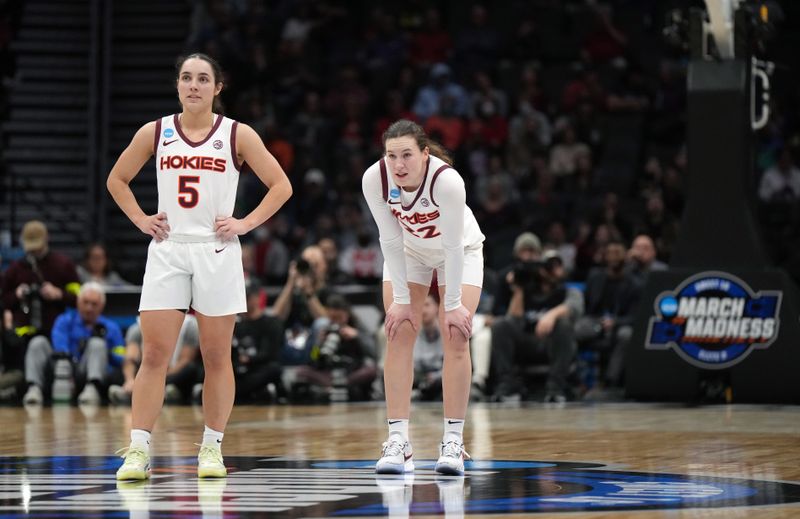 Mar 27, 2023; Seattle, WA, USA; Virginia Tech Hokies guards Georgia Amoore (5) and Cayla King (22) look on during the third quarter against the Ohio State Buckeyes at Climate Pledge Arena. Mandatory Credit: Kirby Lee-USA TODAY Sports 