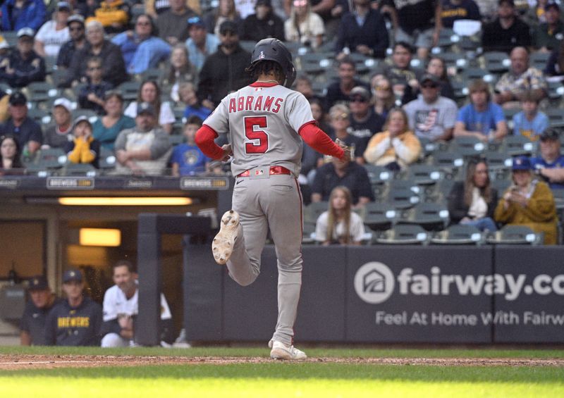 Sep 17, 2023; Milwaukee, Wisconsin, USA; Washington Nationals shortstop CJ Abrams (5) scores a run in the eleventh inning to defeat the Milwaukee Brewers 2-1 at American Family Field. Mandatory Credit: Michael McLoone-USA TODAY Sports
