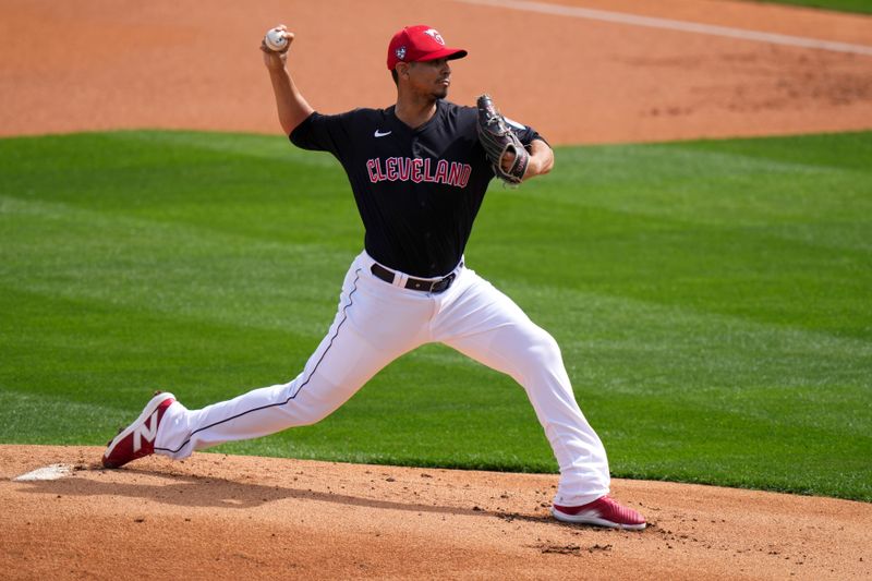 Feb. 24, 2024; Goodyear, Arizona, USA; Cleveland Guardians pitcher Carlos Carrasco delivers a pitch in the first inning during a MLB spring training game against the Cincinnati Reds at Goodyear Ballpark. Mandatory Credit: Kareem Elgazzar-USA TODAY Sports