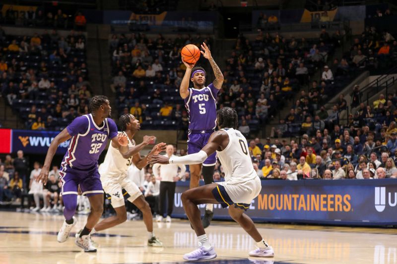 Feb 25, 2025; Morgantown, West Virginia, USA; TCU Horned Frogs forward Micah Robinson (5) shoots a three pointer during the second half against the West Virginia Mountaineers at WVU Coliseum. Mandatory Credit: Ben Queen-Imagn Images