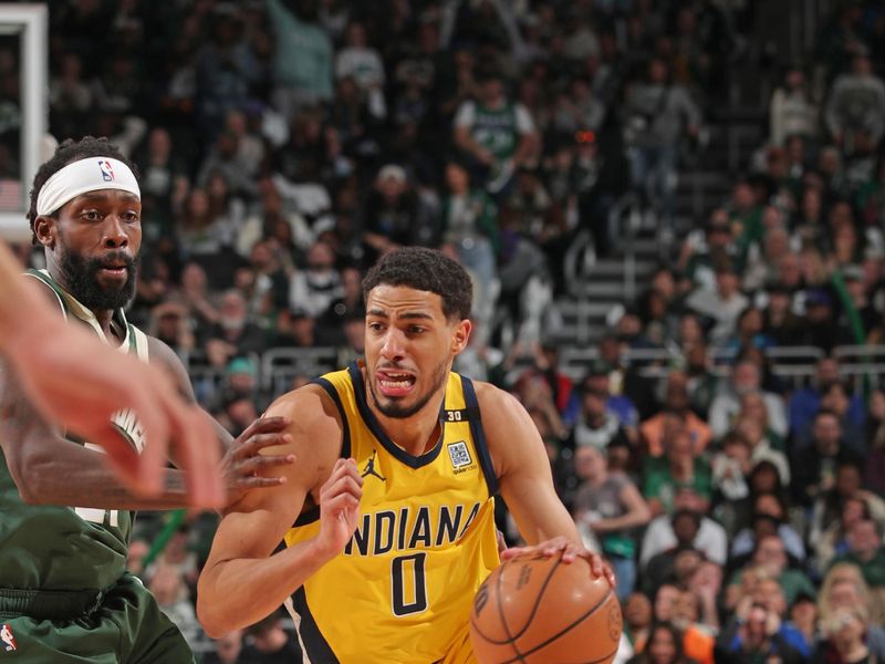 MILWAUKEE, WI - APRIL 21: Tyrese Haliburton #0 of the Indiana Pacers dribbles the ball during the game against the Milwaukee Bucks during Round 1 Game 1 of the 2024 NBA Playoffs on April 21, 2024 at the Fiserv Forum Center in Milwaukee, Wisconsin. NOTE TO USER: User expressly acknowledges and agrees that, by downloading and or using this Photograph, user is consenting to the terms and conditions of the Getty Images License Agreement. Mandatory Copyright Notice: Copyright 2024 NBAE (Photo by Gary Dineen/NBAE via Getty Images).