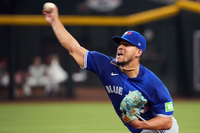Jul 13, 2024; Phoenix, Arizona, USA; Toronto Blue Jays pitcher José Berríos (17) pitches against the Arizona Diamondbacks during the first inning at Chase Field. Mandatory Credit: Joe Camporeale-USA TODAY Sports