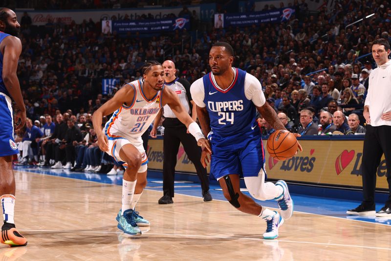 OKLAHOMA CITY, OK - FEBRUARY 22:  Norman Powell #24 of the LA Clippers handles the ball during the game against the Oklahoma City Thunder on February 22SF, 2024 at Paycom Arena in Oklahoma City, Oklahoma. NOTE TO USER: User expressly acknowledges and agrees that, by downloading and or using this photograph, User is consenting to the terms and conditions of the Getty Images License Agreement. Mandatory Copyright Notice: Copyright 2024 NBAE (Photo by Zach Beeker/NBAE via Getty Images)