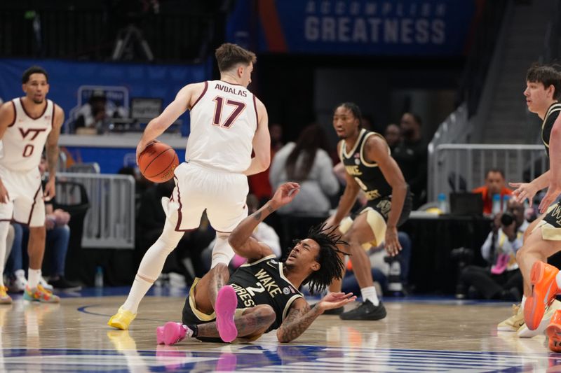 Mar 10, 2026; Charlotte, NC, USA; Virginia Tech Hokies guard Neoklis Avdalas (17) with the ball as Wake Forest Demon Deacons forward Juke Harris (2) defends in the first half at Spectrum Center. Mandatory Credit: Bob Donnan-Imagn Images
