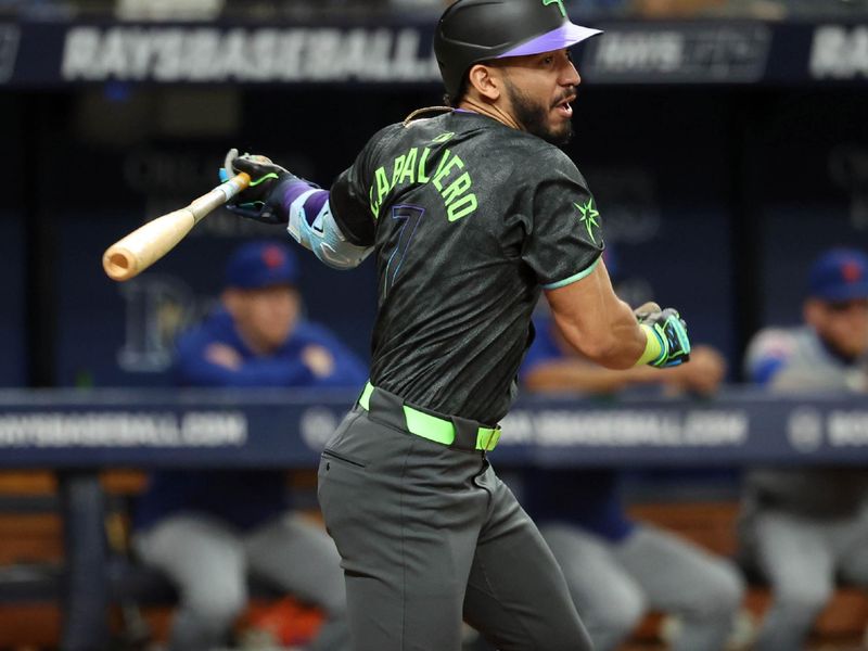 May 3, 2024; St. Petersburg, Florida, USA;  Tampa Bay Rays shortstop José Caballero (7) singles during the third inning against the New York Mets at Tropicana Field. Mandatory Credit: Kim Klement Neitzel-USA TODAY Sports