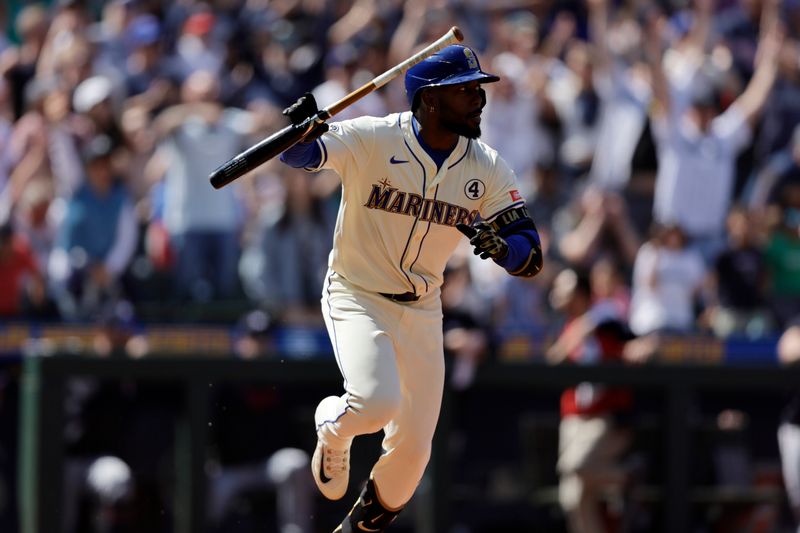 Jun 1, 2025; Seattle, Washington, USA; Seattle Mariners Left fielder Randy Arozarena (56) hits a walkoff single against the Minnesota Twins during the ninth inning at T-Mobile Park. Mandatory Credit: John Froschauer-Imagn Images