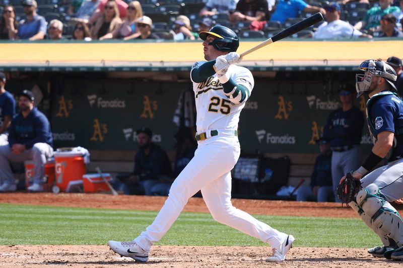 Sep 20, 2023; Oakland, California, USA; Oakland Athletics designated hitter Brett Rooker (25) hits a solo home run against the Seattle Mariners during the sixth inning at Oakland-Alameda County Coliseum. Mandatory Credit: Kelley L Cox-USA TODAY Sports