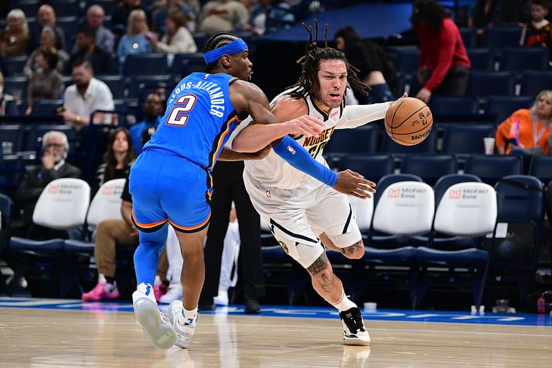 OKLAHOMA CITY, OKLAHOMA - JANUARY 31: Aaron Gordon #50 of the Denver Nuggets attempts to drive past Shai Gilgeous-Alexander #2 of the Oklahoma City Thunder during the second half at Paycom Center on January 31, 2024 in Oklahoma City, Oklahoma. NOTE TO USER: User expressly acknowledges and agrees that, by downloading and or using this Photograph, user is consenting to the terms and conditions of the Getty Images License Agreement. (Photo by Joshua Gateley/Getty Images)