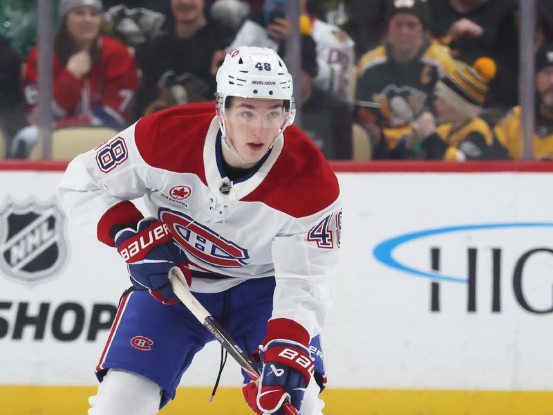 Dec 21, 2025; Pittsburgh, Pennsylvania, USA;  Montréal Canadiens defenseman Lane Hutson (48) skates up ice with the puck against the Pittsburgh Penguins during the second period at PPG Paints Arena. Mandatory Credit: Charles LeClaire-Imagn Images