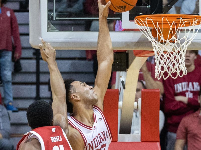 Jan 14, 2023; Bloomington, Indiana, USA; Indiana Hoosiers forward Trayce Jackson-Davis (23) shoots the ball while Wisconsin Badgers forward Chris Hodges (21) defends in the second half at Simon Skjodt Assembly Hall. Mandatory Credit: Trevor Ruszkowski-USA TODAY Sports