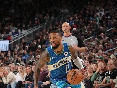 MILWAUKEE, WI - NOVEMBER 24: Damian Lillard #0 of the Milwaukee Bucks drives to the basket during the game against the Washington Wizards during the In-Season Tournament on November 24, 2023 at the Fiserv Forum Center in Milwaukee, Wisconsin. NOTE TO USER: User expressly acknowledges and agrees that, by downloading and or using this Photograph, user is consenting to the terms and conditions of the Getty Images License Agreement. Mandatory Copyright Notice: Copyright 2023 NBAE (Photo by Gary Dineen/NBAE via Getty Images).