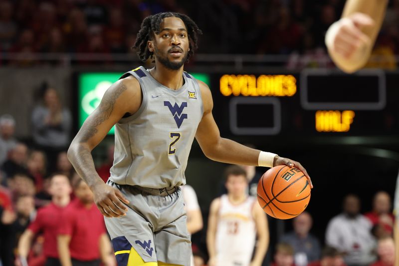 Feb 24, 2024; Ames, Iowa, USA; West Virginia Mountaineers guard Kobe Johnson (2) sets the offense against the Iowa State Cyclones during the second half at James H. Hilton Coliseum. Mandatory Credit: Reese Strickland-USA TODAY Sports