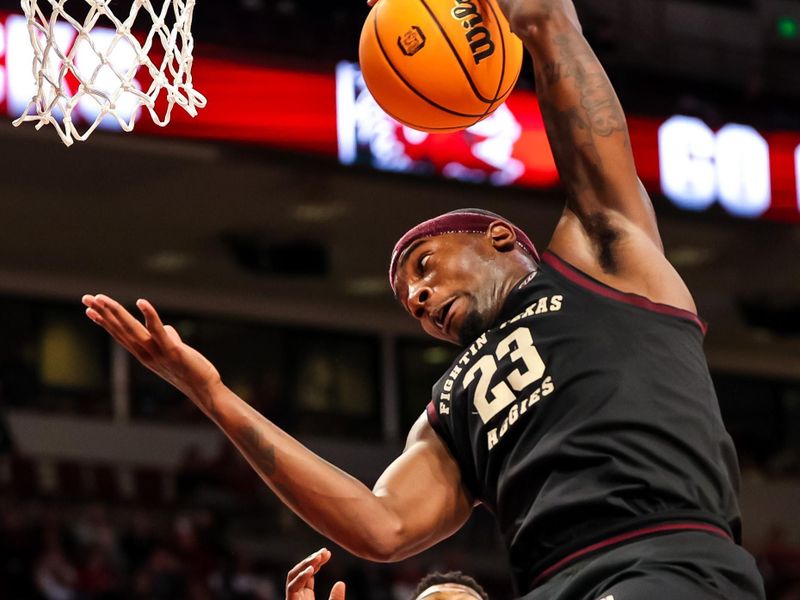 Jan 14, 2023; Columbia, South Carolina, USA; Texas A&M Aggies guard Tyrece Radford (23) grabs a rebound over South Carolina Gamecocks guard Jacobi Wright (1) in the second half at Colonial Life Arena. Mandatory Credit: Jeff Blake-USA TODAY Sports