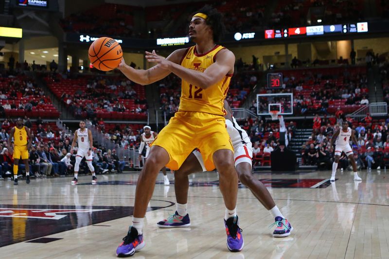 Jan 30, 2023; Lubbock, Texas, USA;  Iowa State Cyclones forward Robert Jones (12) takes an inbound pass in front of Texas Tech Red Raiders guard Elijah Fisher (22) in the first half at United Supermarkets Arena. Mandatory Credit: Michael C. Johnson-USA TODAY Sports